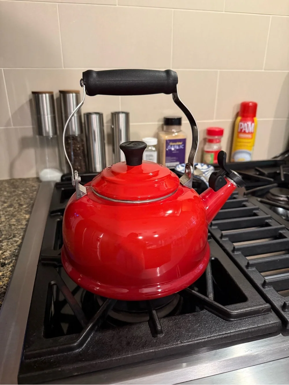 Le Crueset Red Whistling Stovetop Kettle with Black Handle